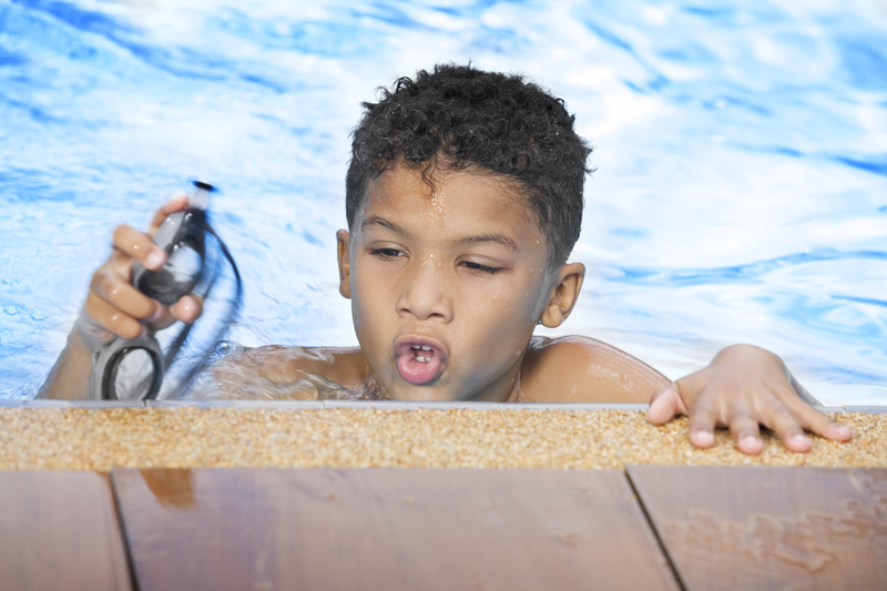 Boy holding goggles