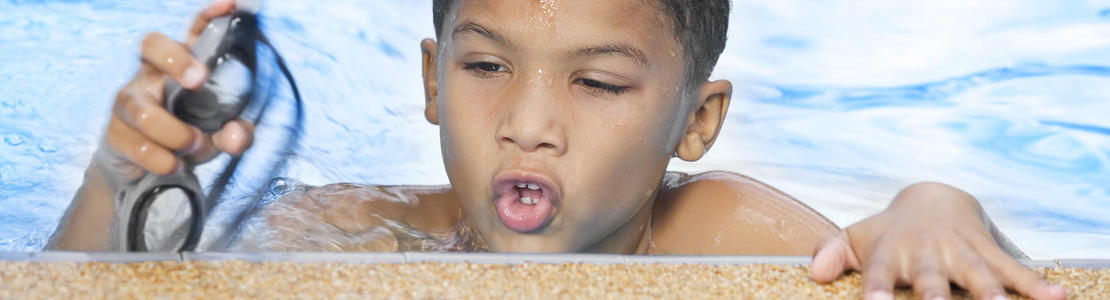 Boy holding goggles